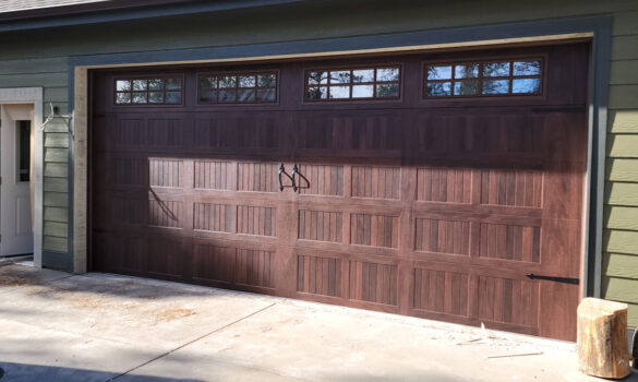 Picture of a gorgeous garage door that was recently installed on a house.